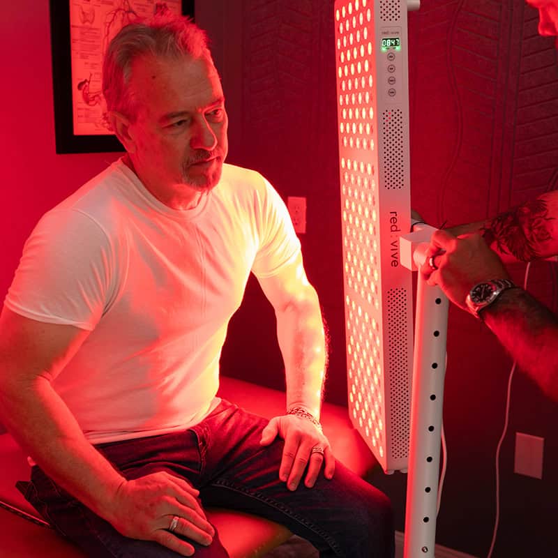 Root-Cause Healthcare treatment using red light therapy as part of a targeted wellness session